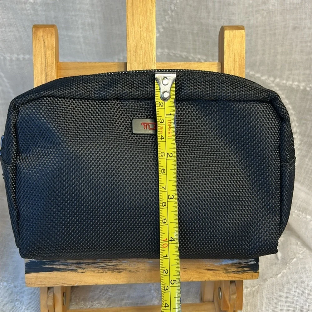TUMI new never used cosmetic bag with some goodies